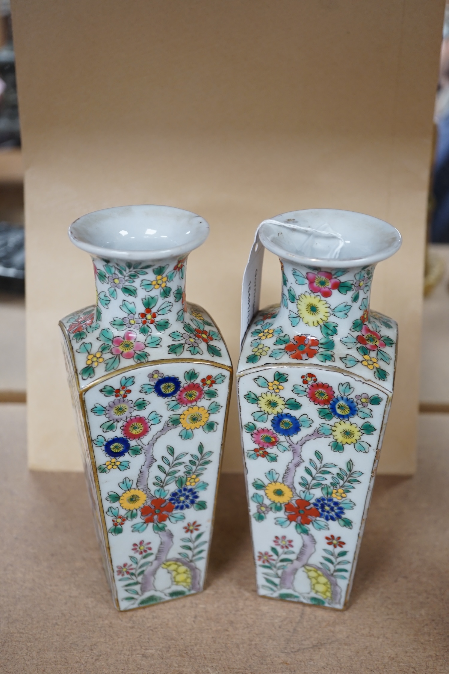 A pair of Japanese floral enamelled square tapering porcelain vases, 18cm high. Condition - good